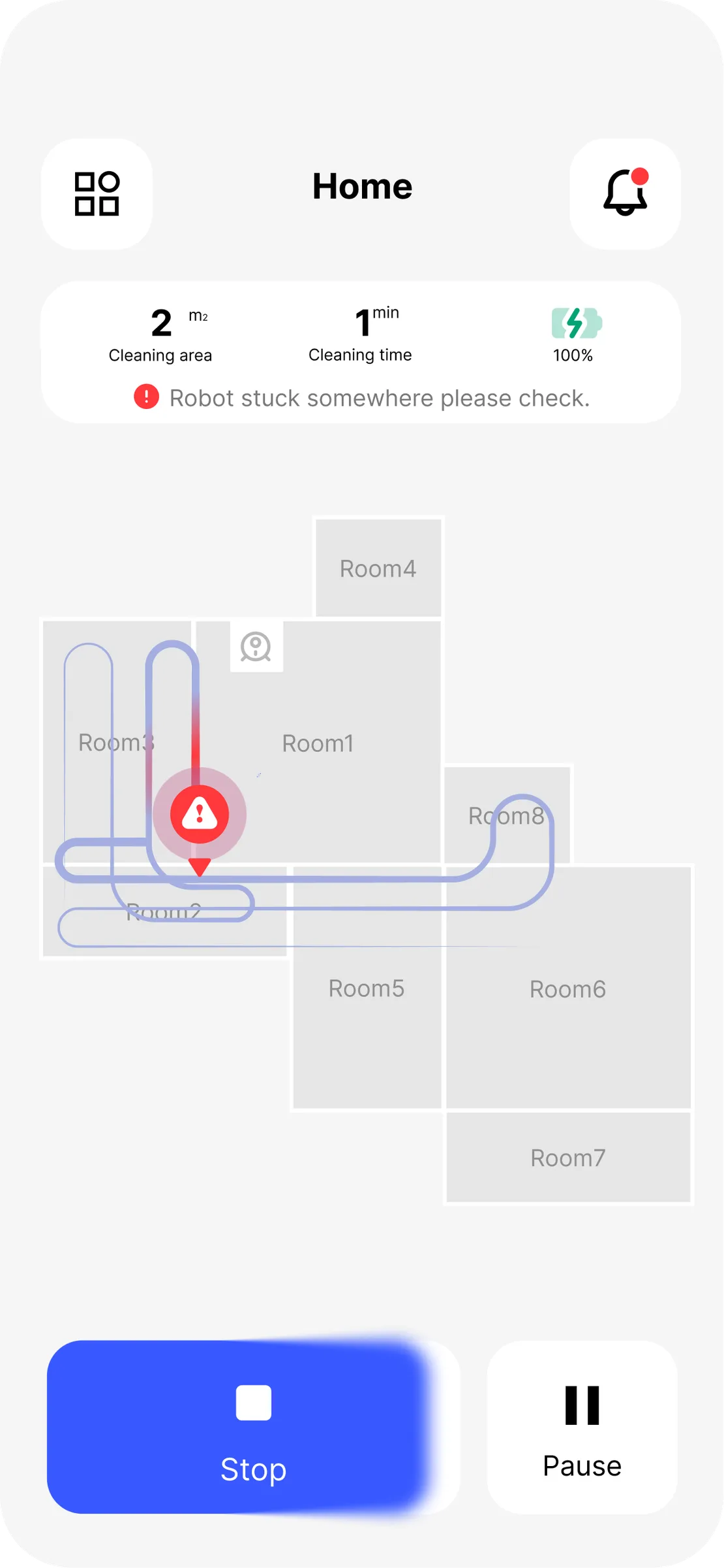 Vacuum App — a stuck-robot banner on the map