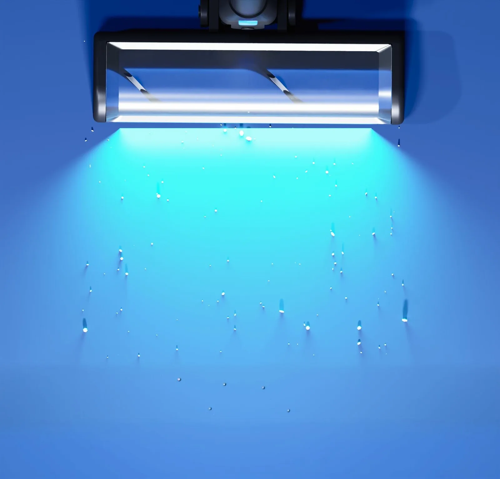 Luma — floor head casting a wide beam across dust on a dark floor