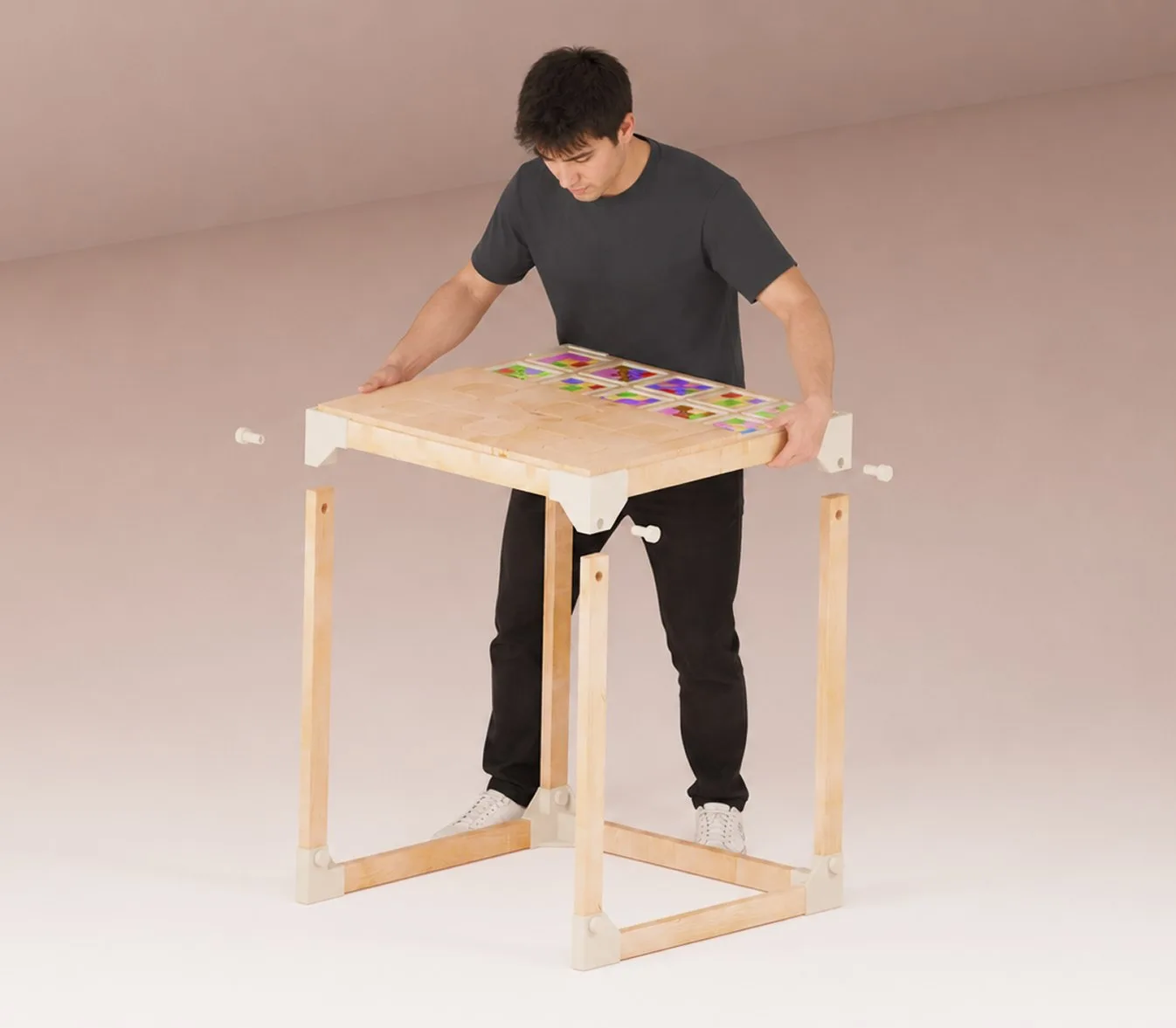 Morpho — an adult assembling the full-scale desk