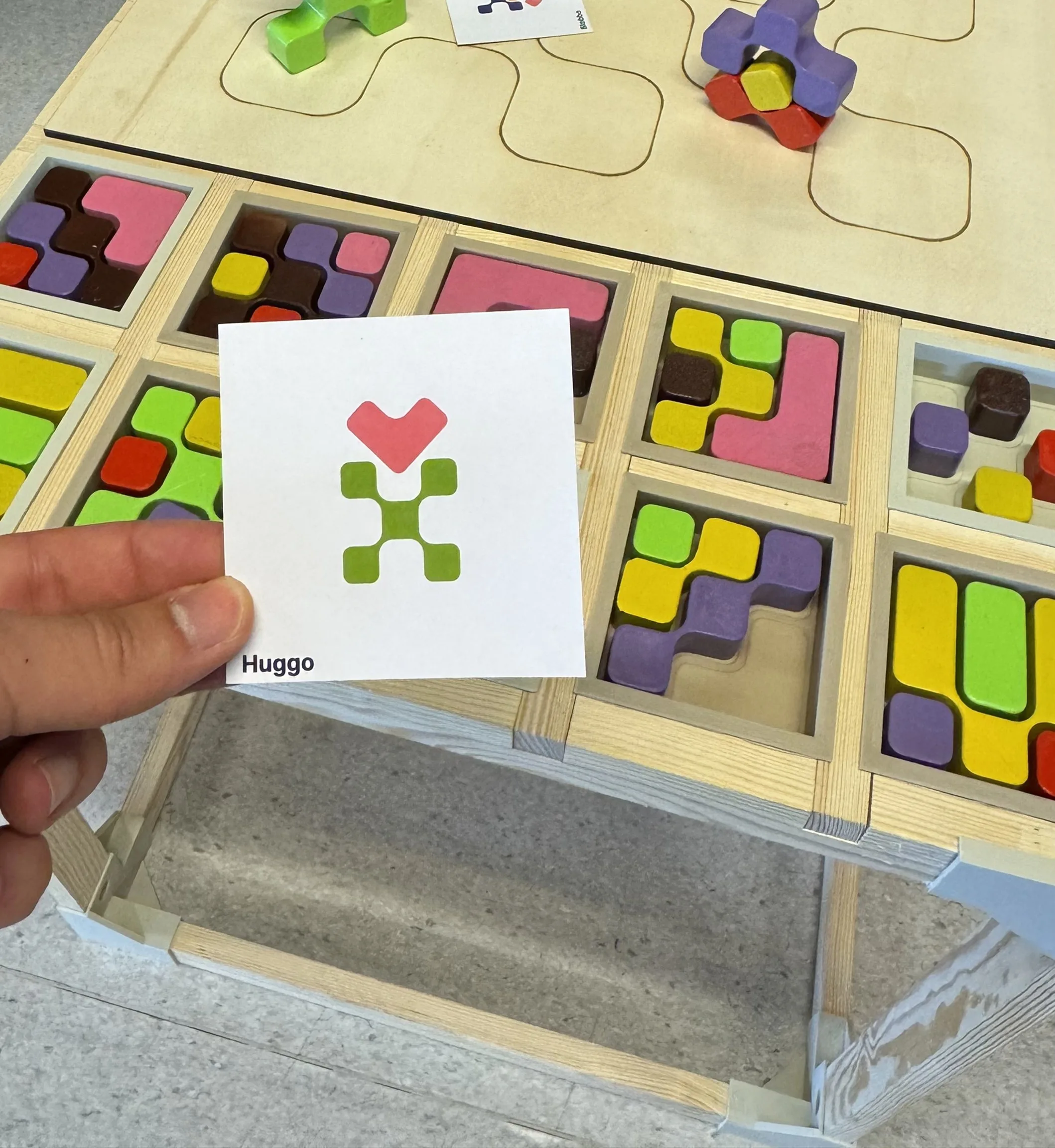 Morpho — a brand card held over the exhibited desk