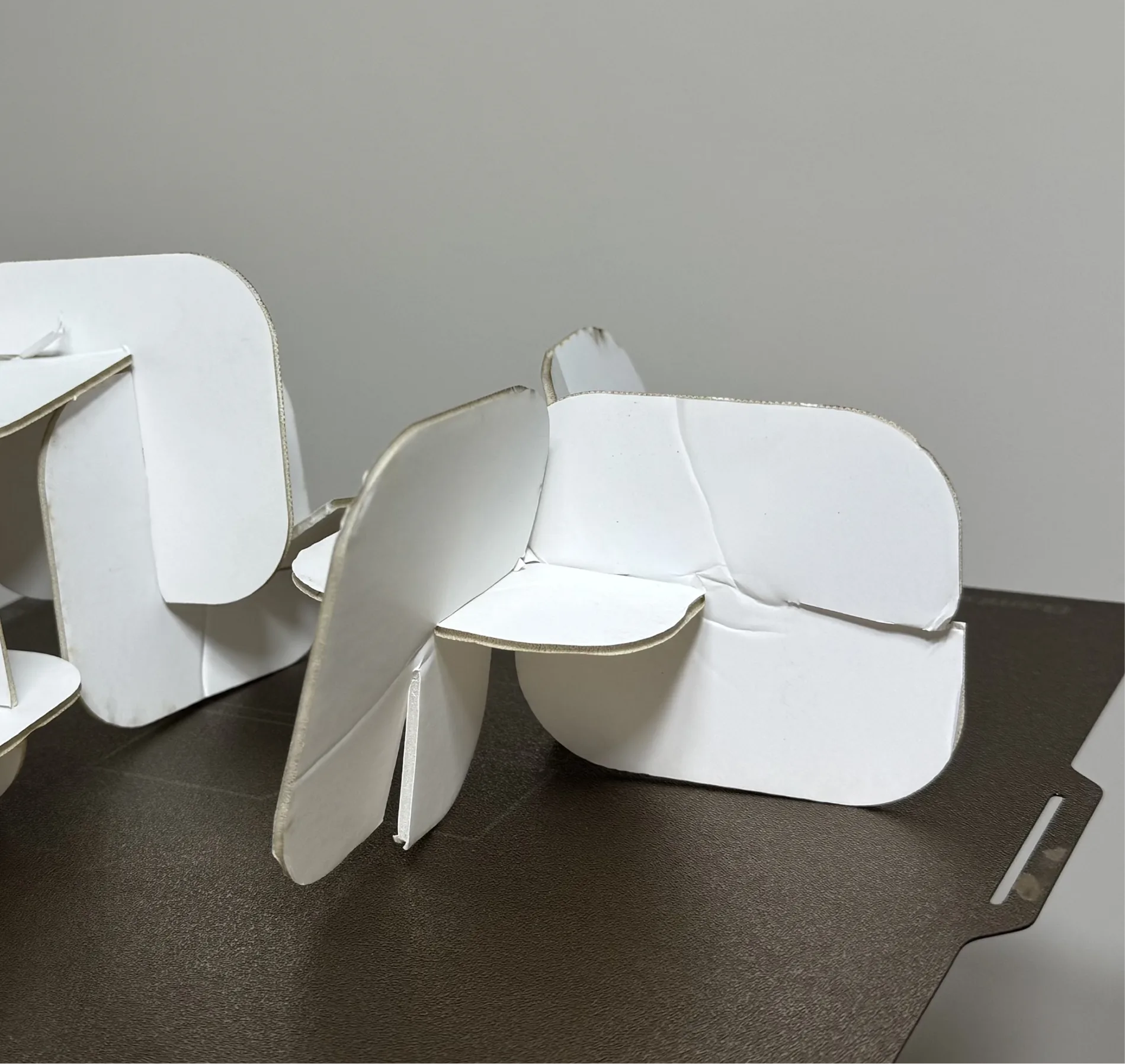 Slot-Fit — cardboard form studies for the panel