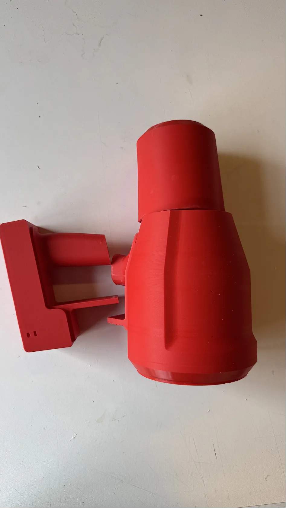 Luma — red printed wall dock, first pass