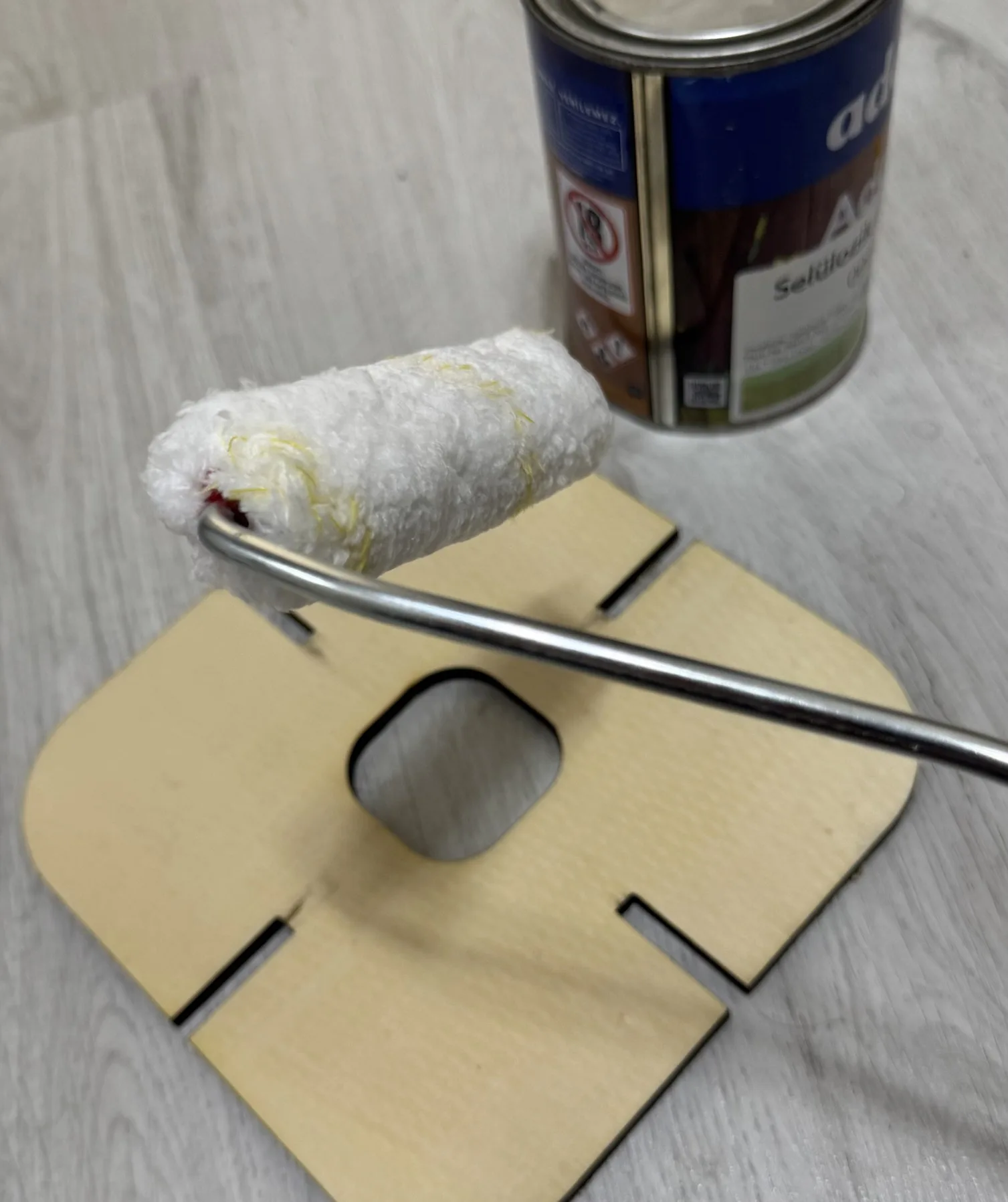 Slot-Fit — rolling sealant onto a cut panel